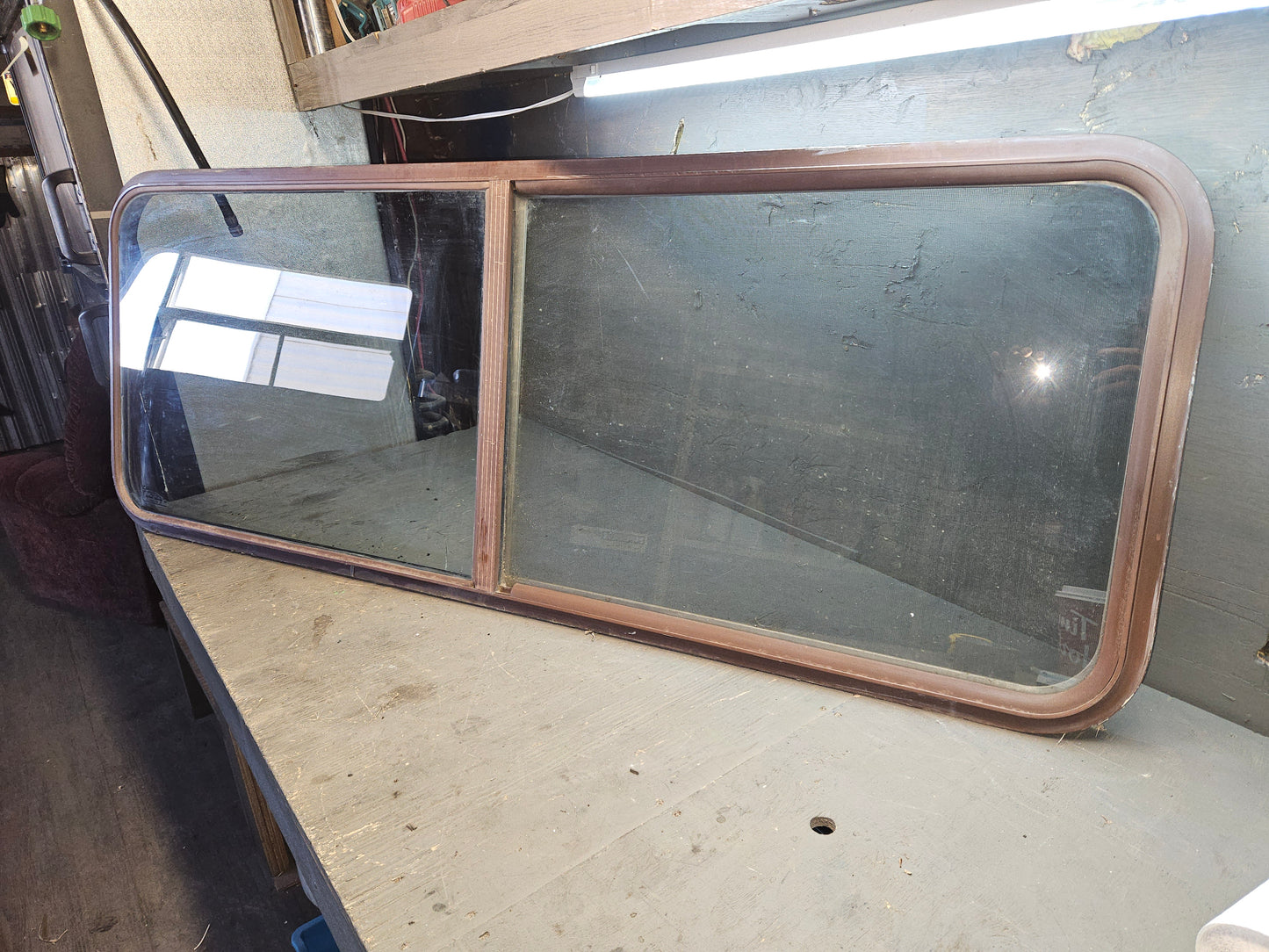 Poor condition brown sliding window