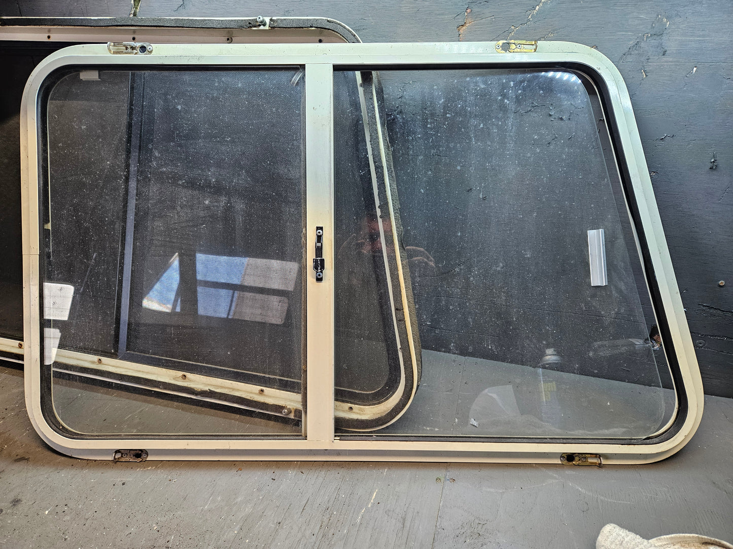 Angle sliding window with storm window black