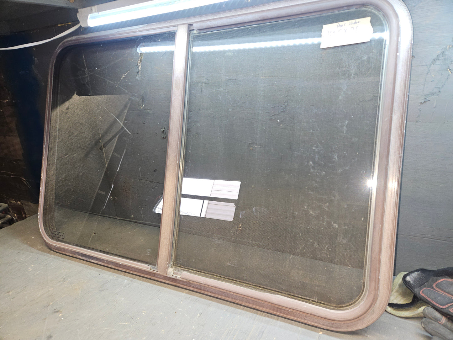 Poor condition brown slider window