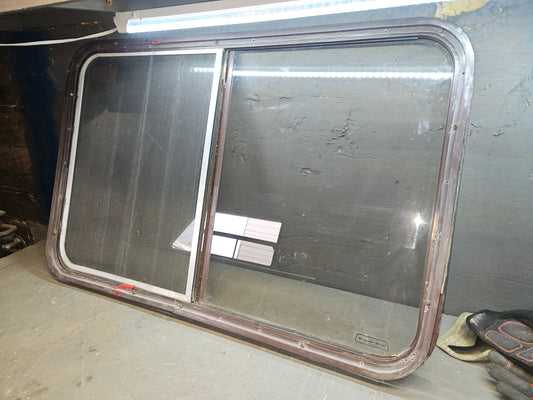 Poor condition brown slider window