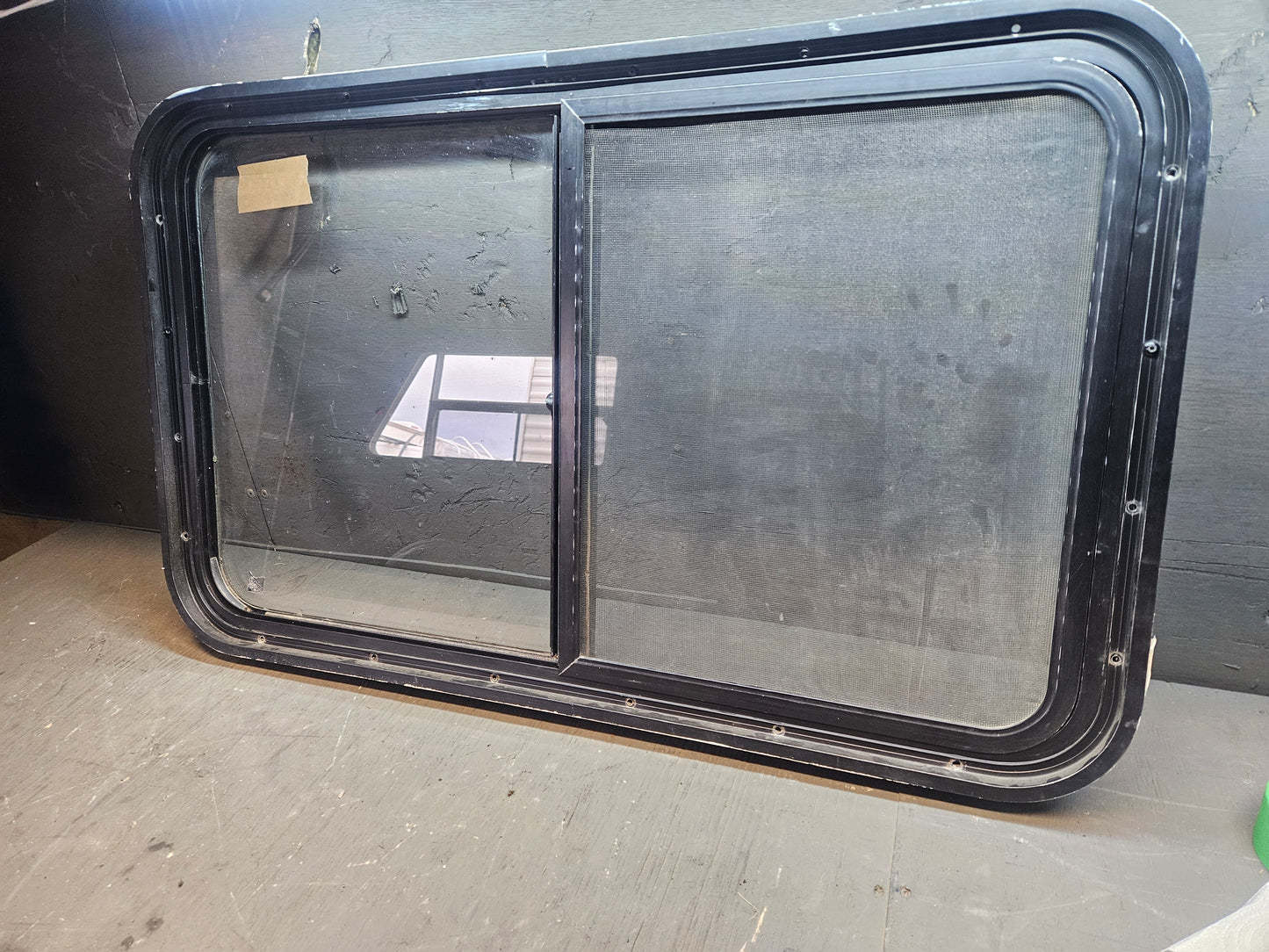 Poor condition slid window black