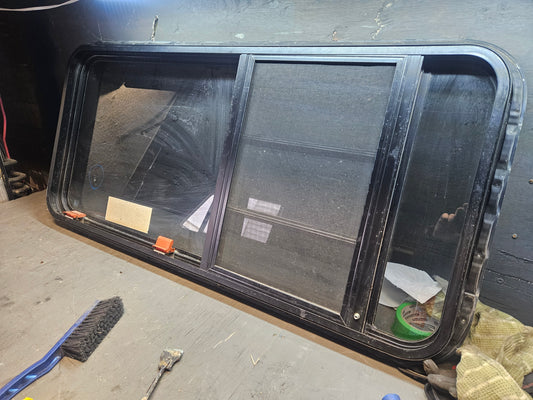 Poor condition combination escape and crank black window