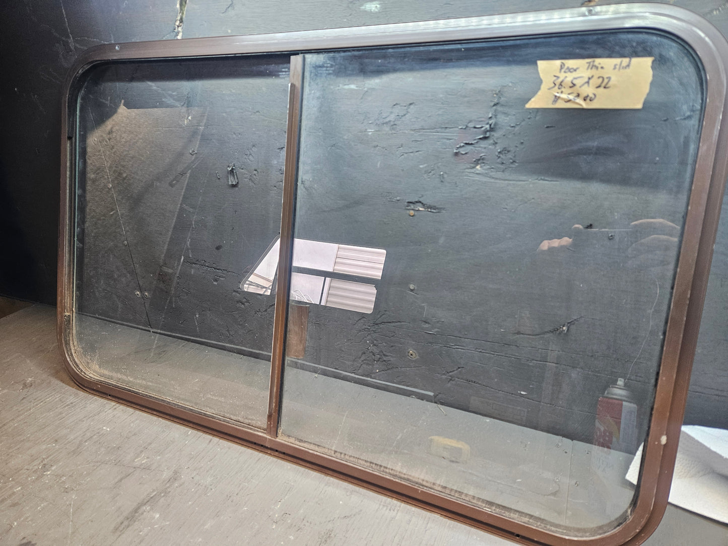 Poor condition brown sliding window