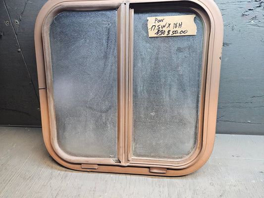 Poor condition brown slid window