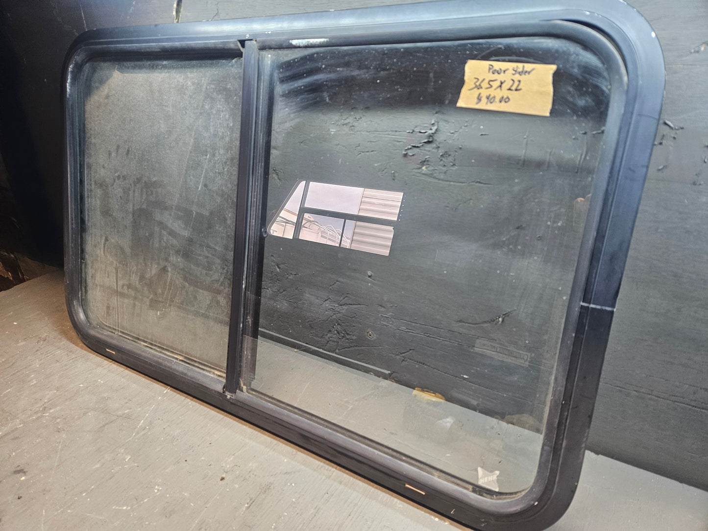 Poor condition slid window black