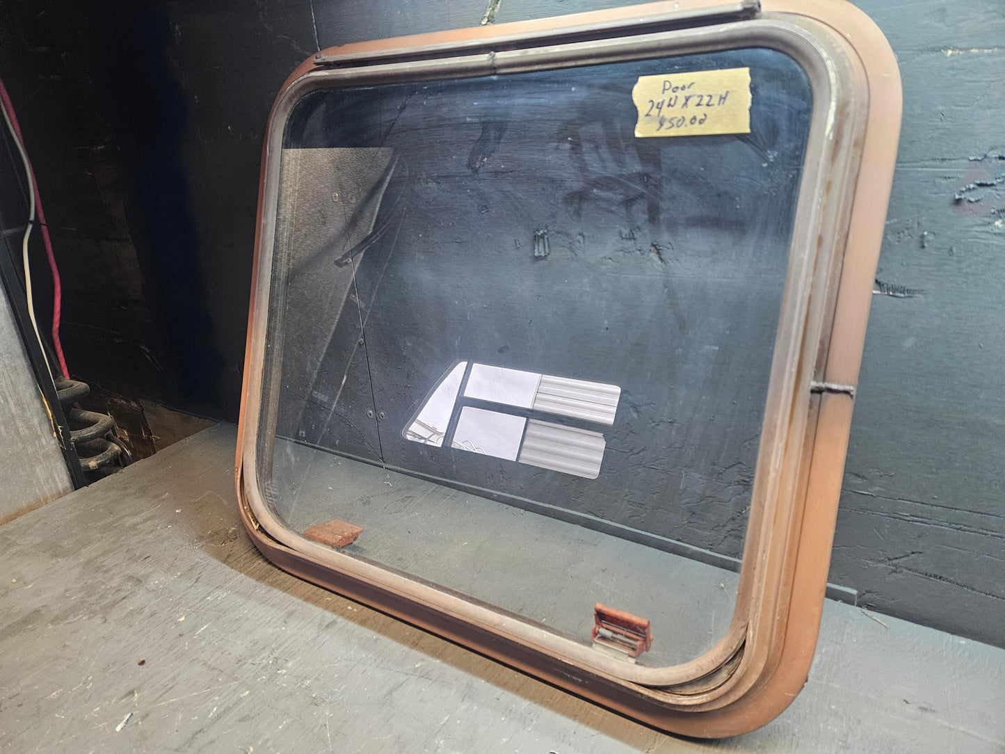 Poor condition escape window brown