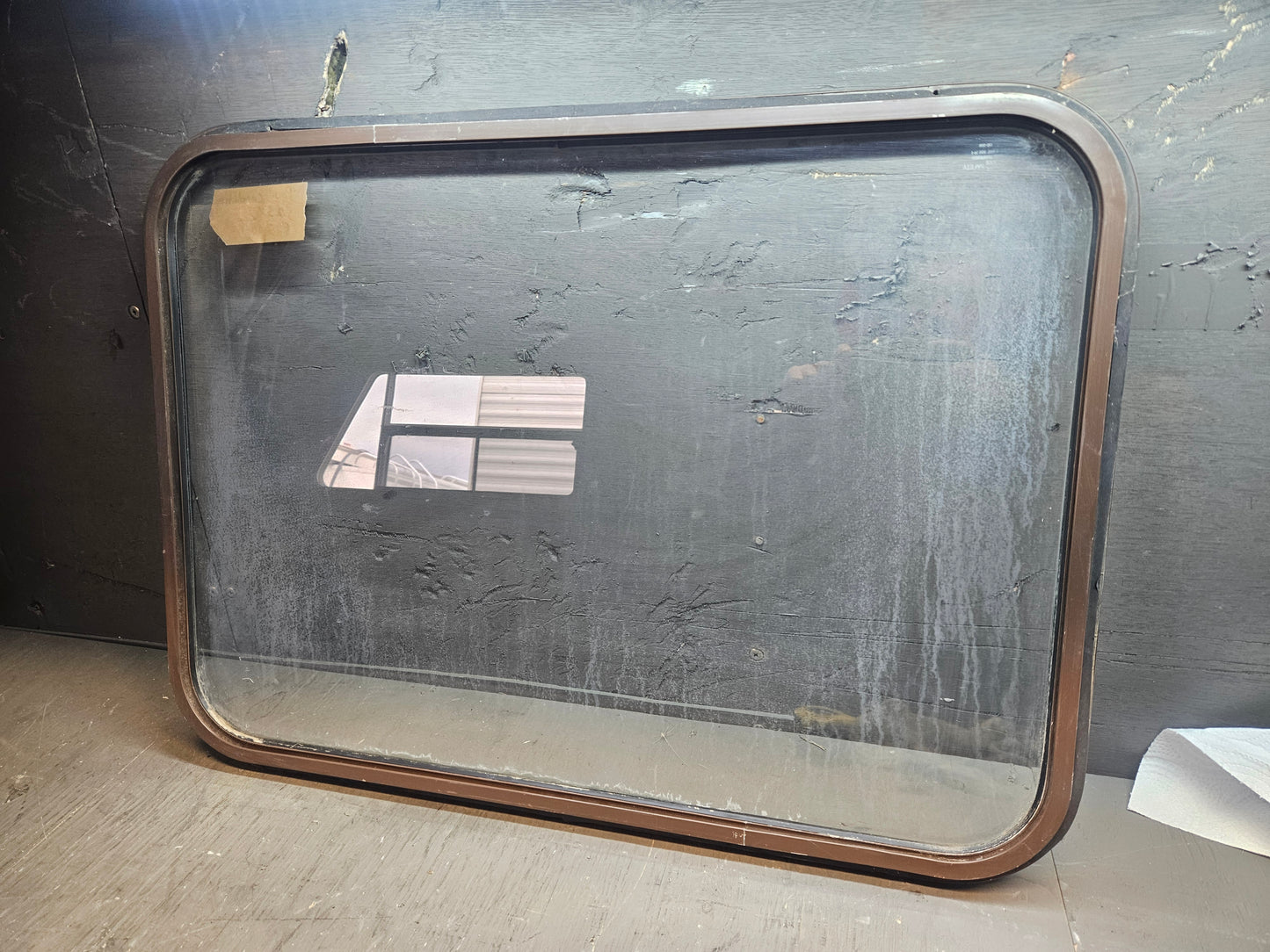 Poor condition window brown.