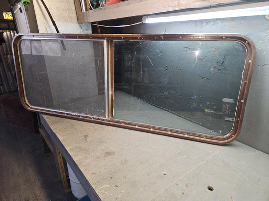 Poor condition brown sliding window