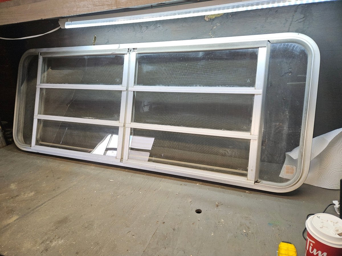 Poor condition silver crank out window