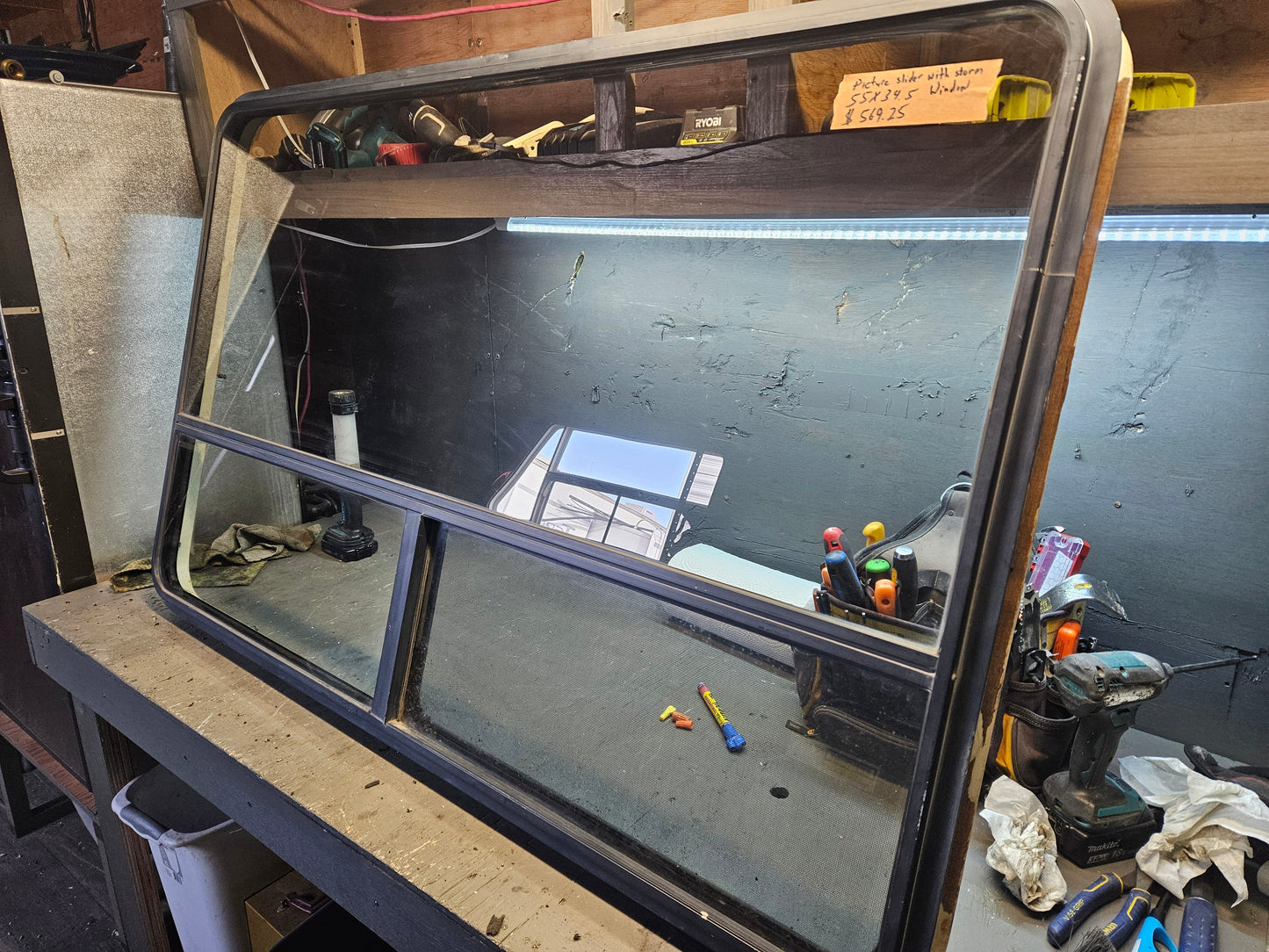 Large picture window with inside storm window black