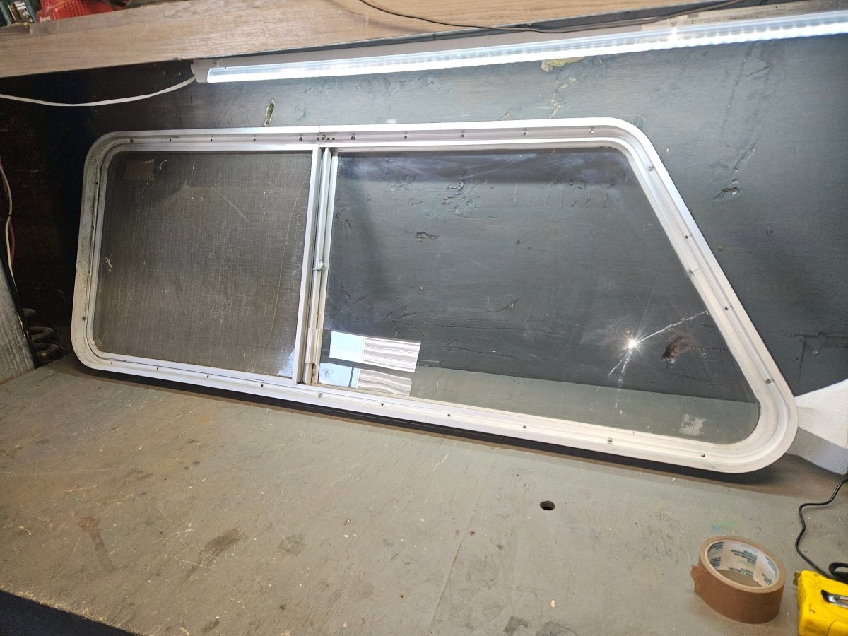 Poor condition silver angle sliding window