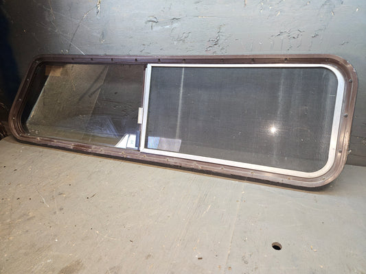 Poor condition brown sliding angle cut window