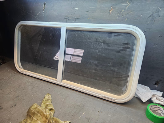 Poor condition sliding window white