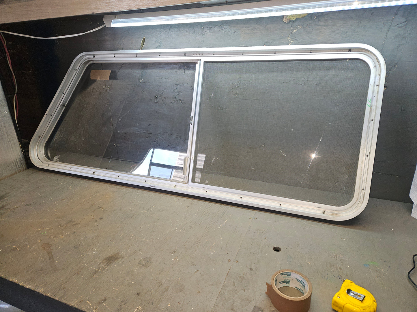 Poor condition silver  angle sliding window