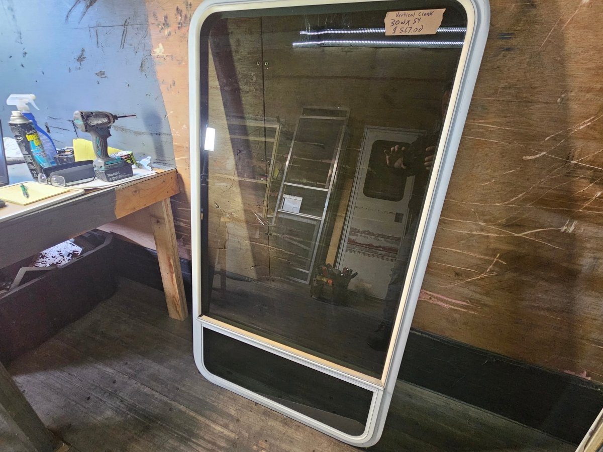Large vertical window  crank out white.