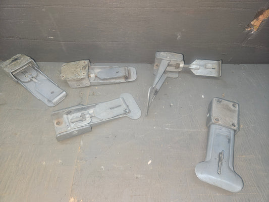 Tent trailer tie down latch