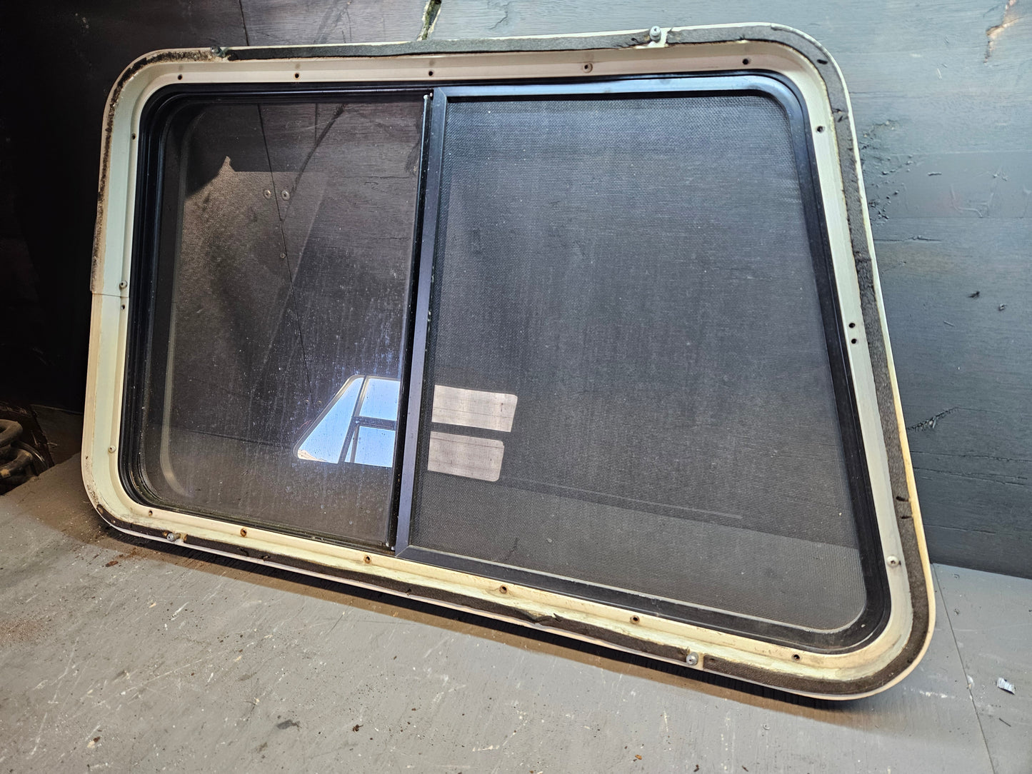 Angle sliding window with storm window black