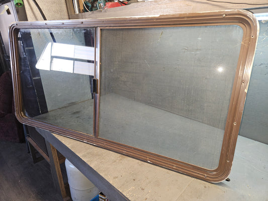 Poor condition brown sliding window