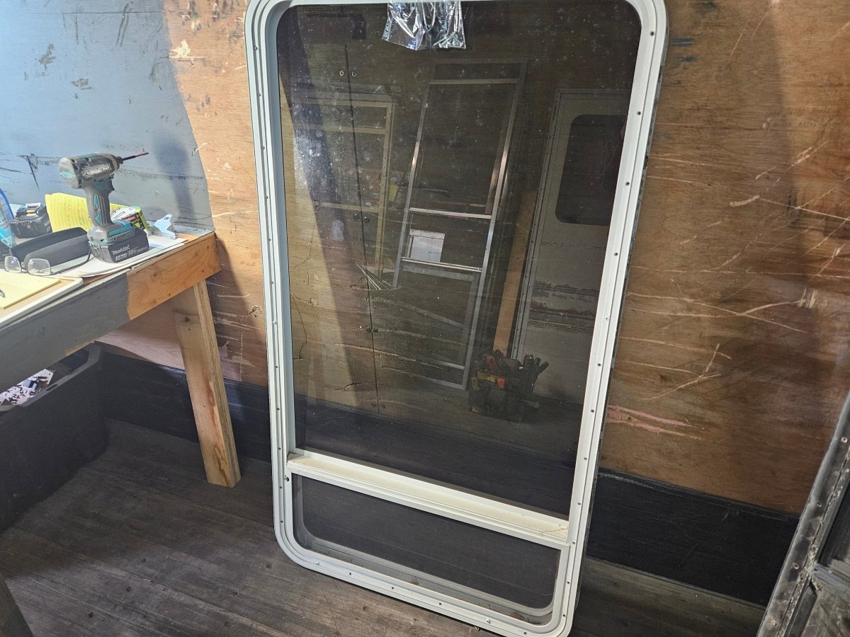 Large vertical window  crank out white.