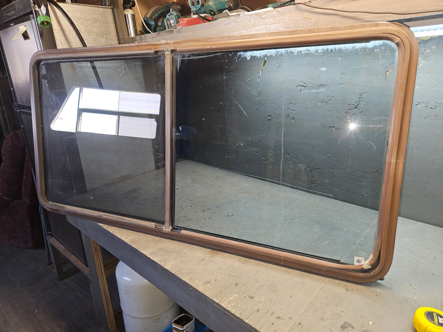 Poor condition brown sliding window