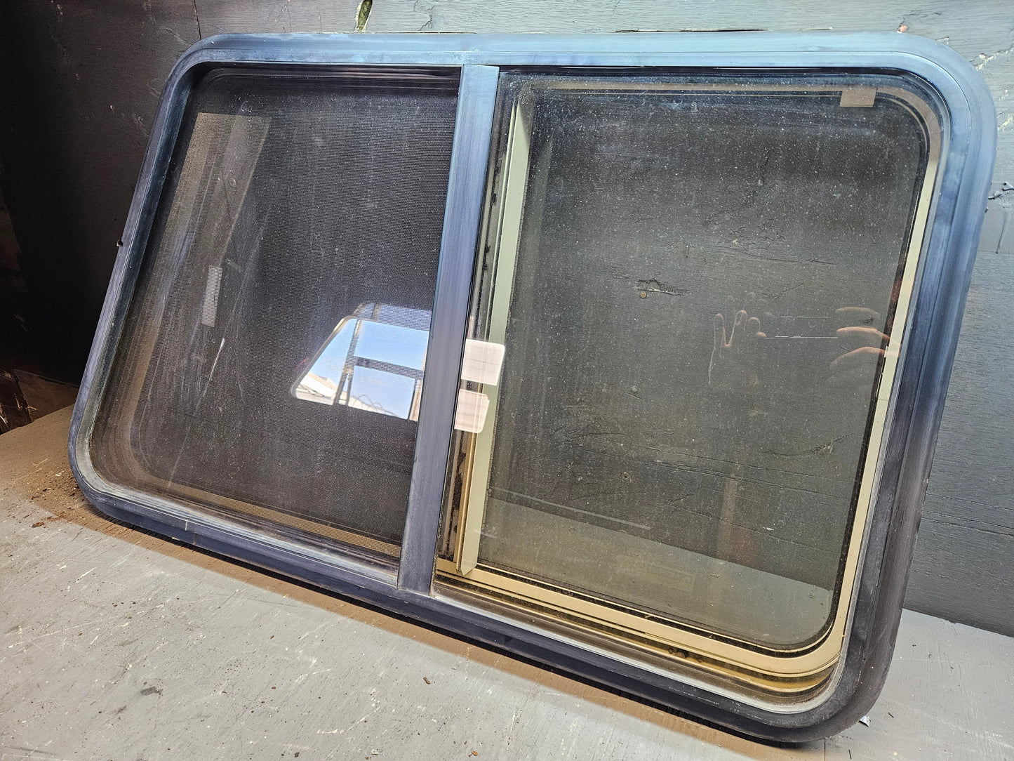Angle sliding window with storm window black