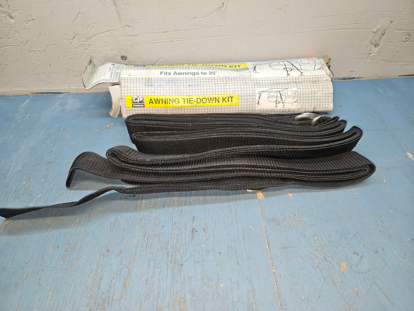 Awning hold down strap