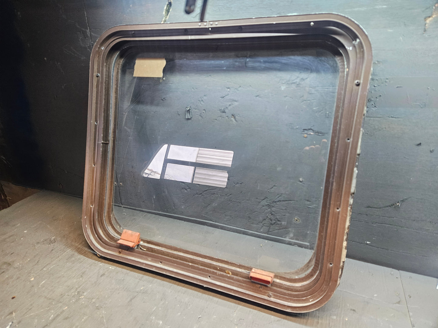 Poor condition escape window brown