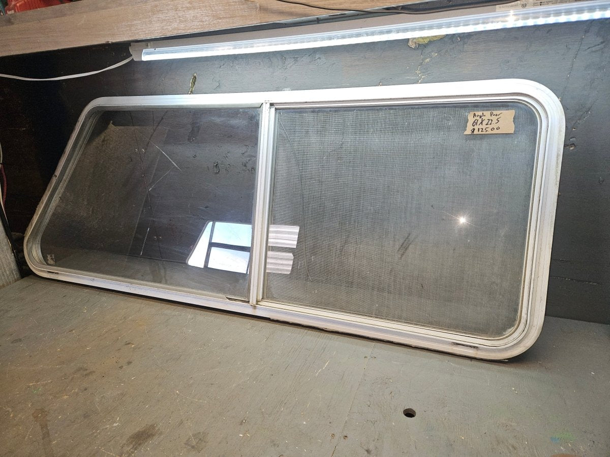 Poor condition silver angle sliding window