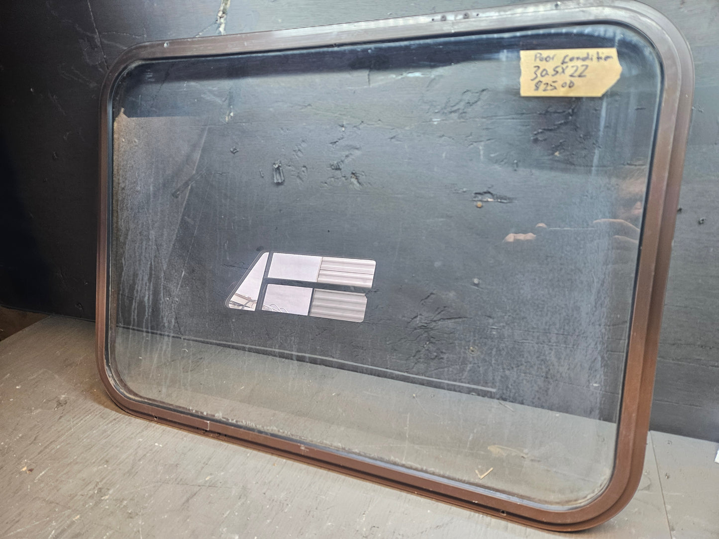 Poor condition window brown.