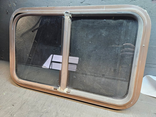 Poor condition slid window brown