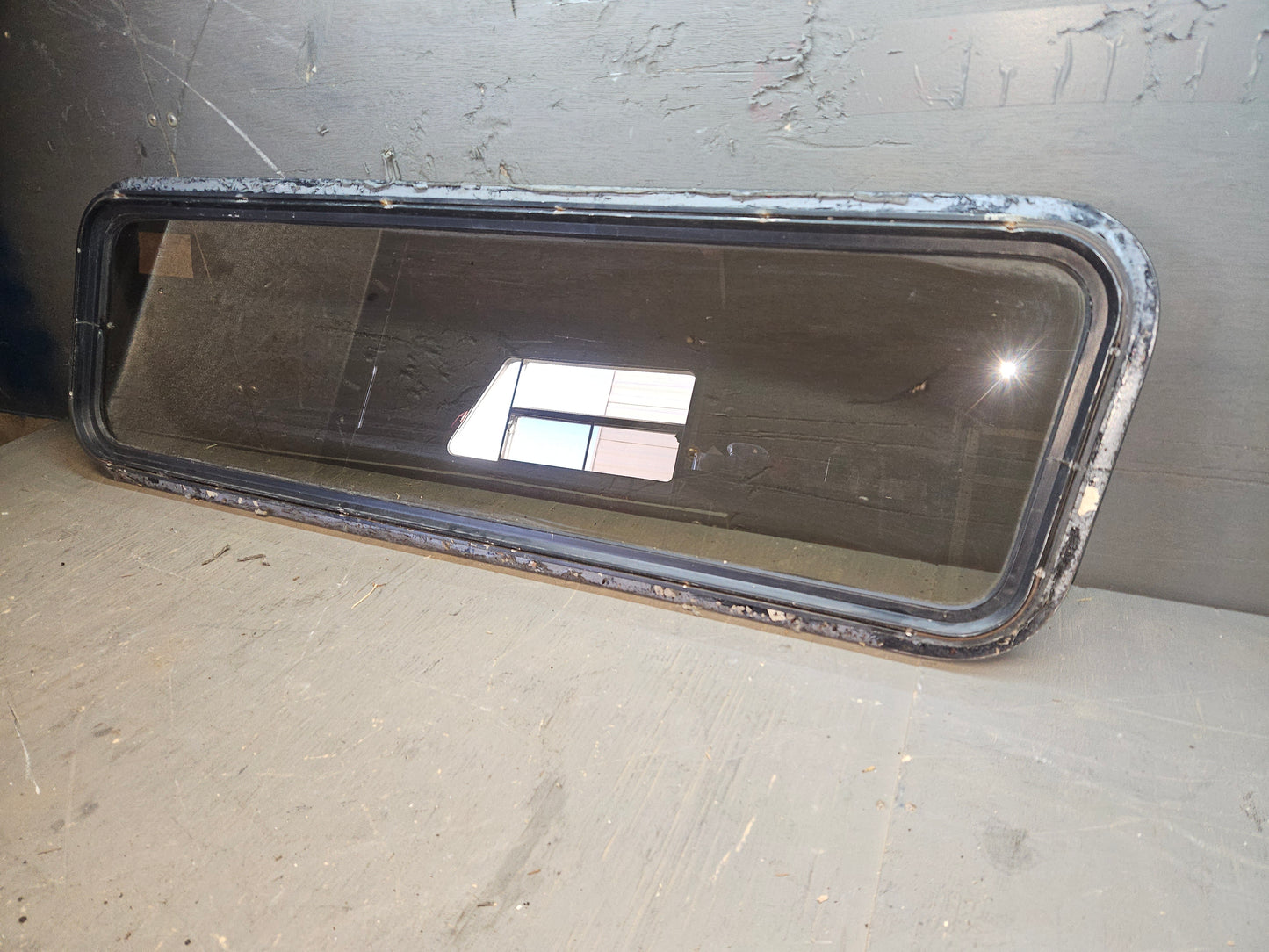 Poor condition non opening black window
