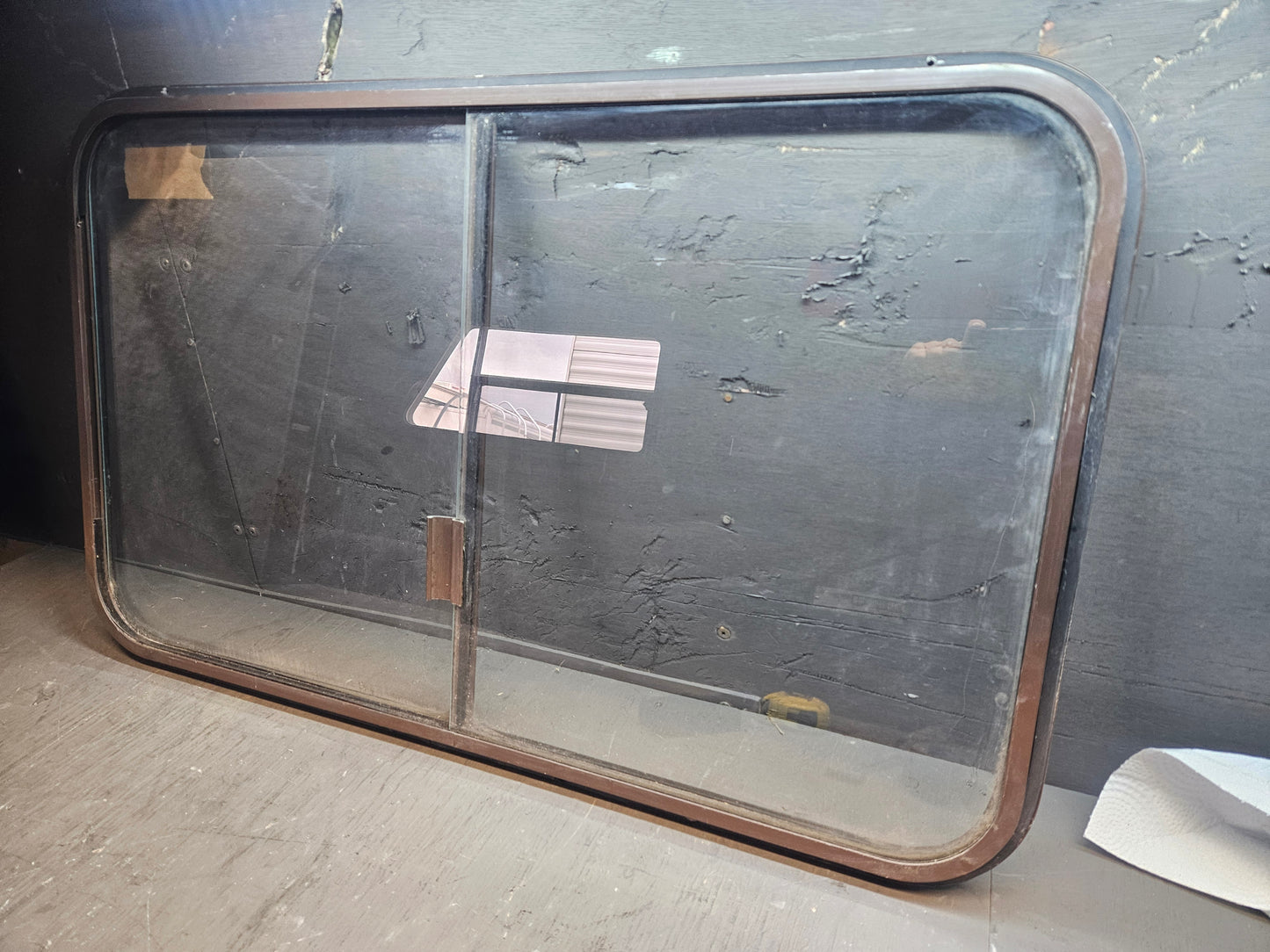 Poor condition brown sliding window