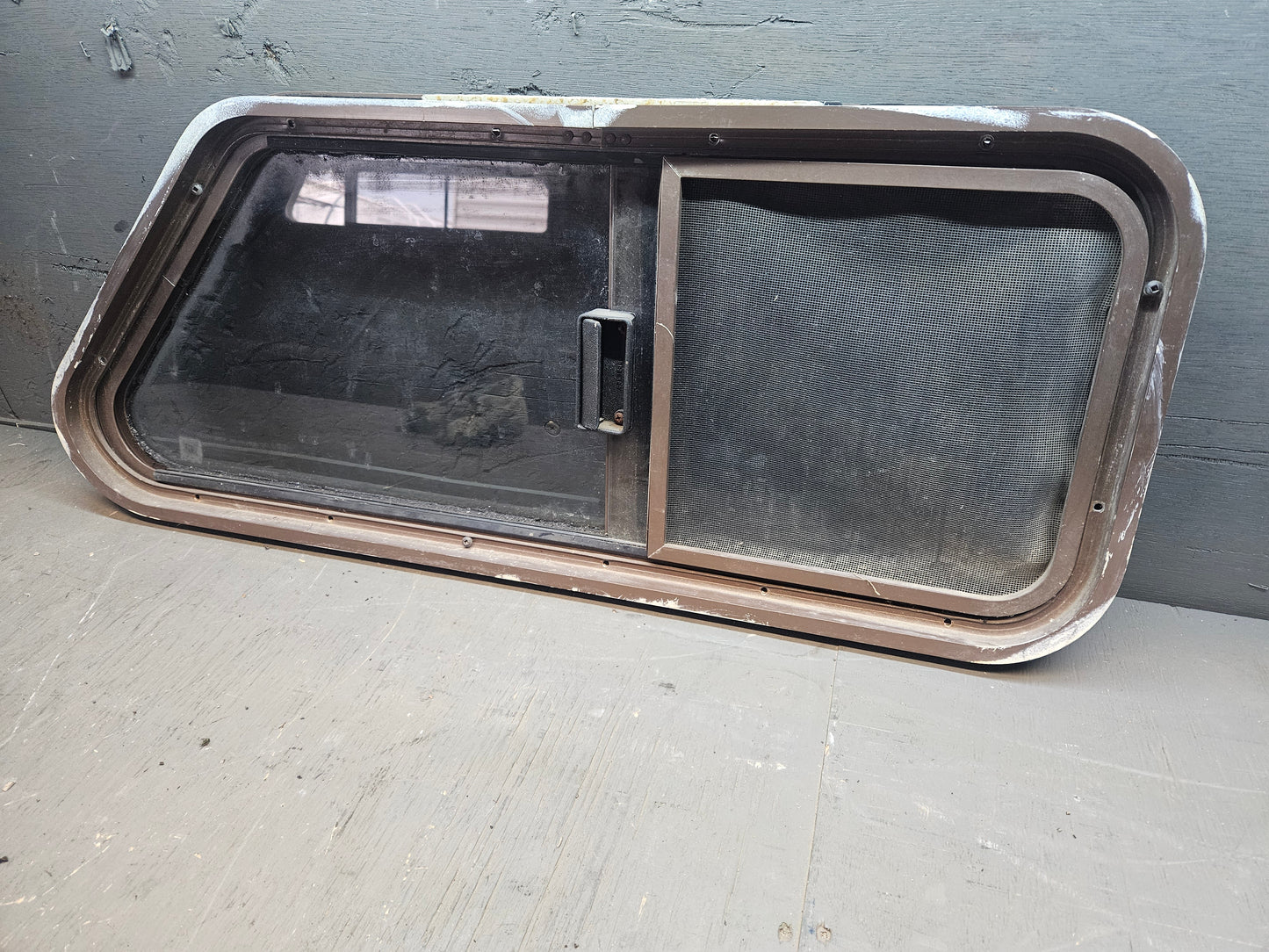 Poor condition angle sliding window brown